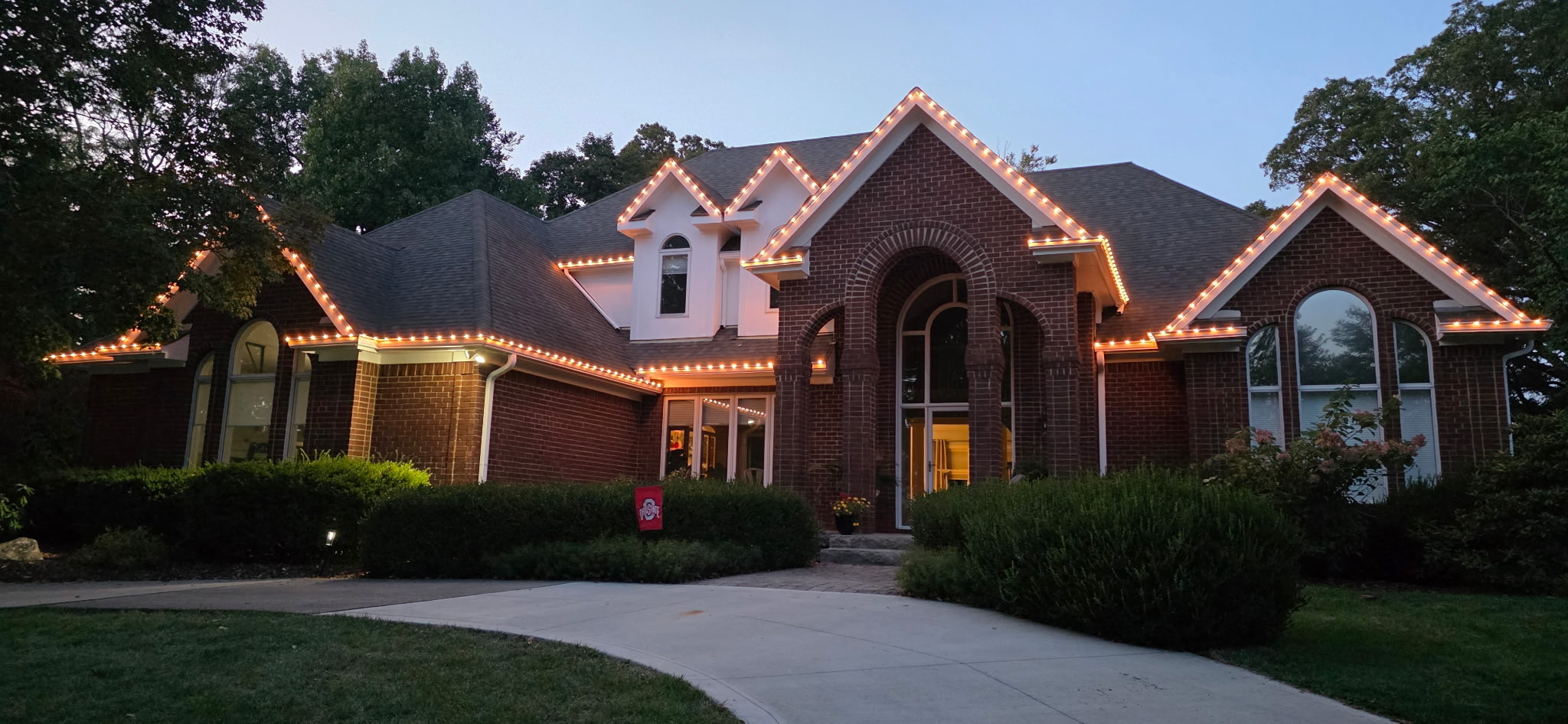 Warm white permanent lighting installed on a Northeast Ohio home